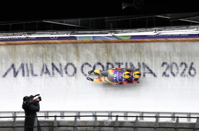 (260212) -- CORTINA D'AMPEZZO, Feb. 12, 2026 (Xinhua) -- Dajana Eitberger/Magdalena Matschina of Germany compete during the luge team relay match at the Milan-Cortina 2026 Olympic Winter Games in Cortina, Italy, Feb. 12, 2026. (Xinhua/Ding Xu)
