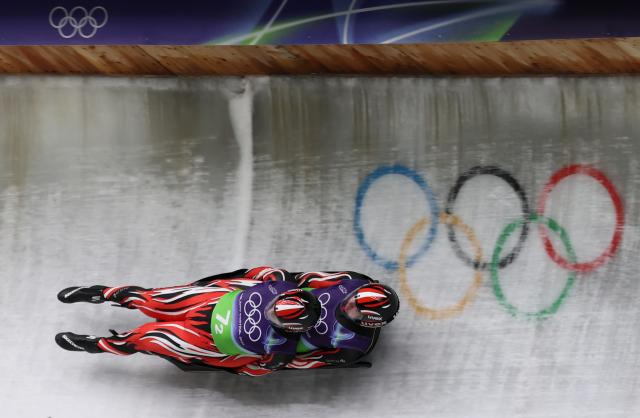 (260212) -- CORTINA D'AMPEZZO, Feb. 12, 2026 (Xinhua) -- Thomas Steu/Wolfgang Kindl of Austria compete during the luge team relay match at the Milan-Cortina 2026 Olympic Winter Games in Cortina, Italy, Feb. 12, 2026. (Xinhua/Ding Xu)