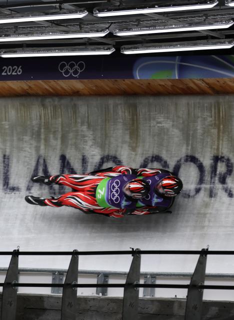(260212) -- CORTINA D'AMPEZZO, Feb. 12, 2026 (Xinhua) -- Thomas Steu/Wolfgang Kindl of Austria compete during the luge team relay match at the Milan-Cortina 2026 Olympic Winter Games in Cortina, Italy, Feb. 12, 2026. (Xinhua/Ding Xu)