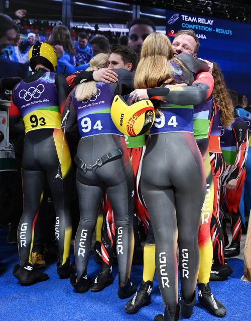 (260212) -- CORTINA D'AMPEZZO, Feb. 12, 2026 (Xinhua) -- Athletes of Germany celebrate after the luge team relay match at the Milan-Cortina 2026 Olympic Winter Games in Cortina, Italy, Feb. 12, 2026. (Xinhua/Lian Yi)