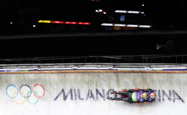 (260212) -- CORTINA D'AMPEZZO, Feb. 12, 2026 (Xinhua) -- Jubayi Saikeyi/Hou Shuo of China compete during the luge team relay match at the Milan-Cortina 2026 Olympic Winter Games in Cortina, Italy, Feb. 12, 2026. (Xinhua/Ding Xu)