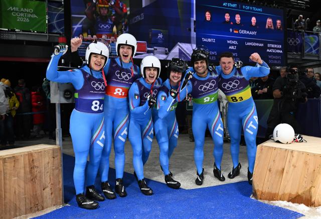 (260212) -- CORTINA D'AMPEZZO, Feb. 12, 2026 (Xinhua) -- Athletes of Italy celebrate after the luge team relay match at the Milan-Cortina 2026 Olympic Winter Games in Cortina, Italy, Feb. 12, 2026. (Xinhua/Lian Yi)