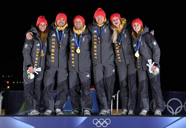 (260212) -- CORTINA D'AMPEZZO, Feb. 12, 2026 (Xinhua) -- Gold medalists from team Germany pose for a photo during the awarding ceremony of the luge team relay match at the Milan-Cortina 2026 Olympic Winter Games in Cortina, Italy, Feb. 12, 2026. (Xinhua/Lian Yi)