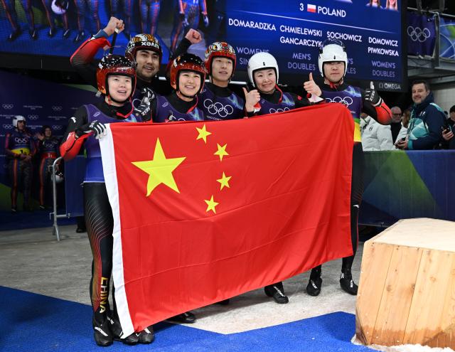 (260212) -- CORTINA D'AMPEZZO, Feb. 12, 2026 (Xinhua) -- Athletes of China pose for a photo after the luge team relay match at the Milan-Cortina 2026 Olympic Winter Games in Cortina, Italy, Feb. 12, 2026. (Xinhua/Lian Yi)