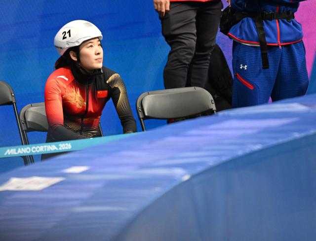 (260212) -- MILAN, Feb. 12, 2026 (Xinhua) -- Zhang Chutong of China reacts during the short track speed skating women's 500m quarterfinals at the Milan-Cortina 2026 Olympic Winter Games in Milan, Italy, Feb. 12, 2026. (Xinhua/Cheng Min)