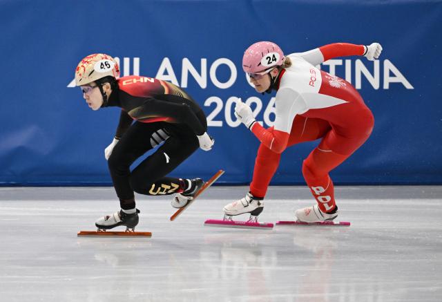 (260212) -- MILAN, Feb. 12, 2026 (Xinhua) -- Fan Kexin (L) of China competes during the short track speed skating women's 500m quarterfinals at the Milan-Cortina 2026 Olympic Winter Games in Milan, Italy, Feb. 12, 2026. (Xinhua/Cheng Min)
