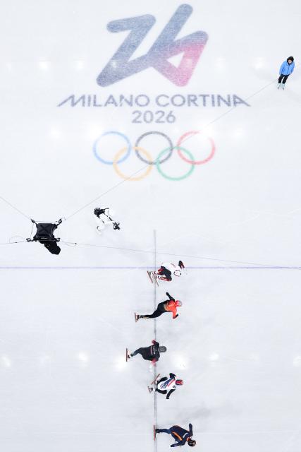 (260212) -- MILAN, Feb. 12, 2026 (Xinhua) -- Athletes compete during the short track speed skating men's 1000m final A at the Milan-Cortina 2026 Olympic Winter Games in Milan, Italy, Feb. 12, 2026. (Xinhua/Chen Yichen)