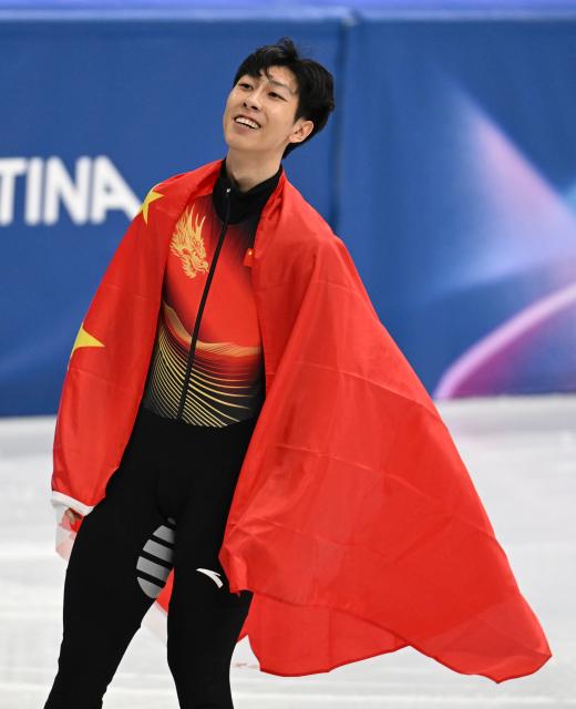 (260212) -- MILAN, Feb. 12, 2026 (Xinhua) -- Sun Long of China celebrates after the short track speed skating men's 1000m final A at the Milan-Cortina 2026 Olympic Winter Games in Milan, Italy, Feb. 12, 2026. (Xinhua/Cheng Min)