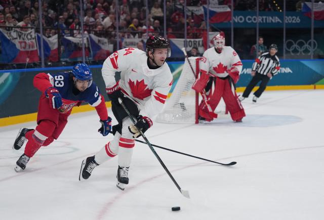 (260212) -- MILAN, Feb. 12, 2026 (Xinhua) -- Josh Morrissey (2nd L) of Canada competes during the ice hockey men's preliminary round group A match between Canada and the Czech Republic at the Milan-Cortina 2026 Olympic Winter Games in Milan, Italy, Feb. 12, 2026. (Xinhua/Tao Xiyi)