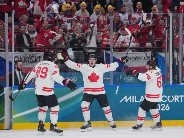(260212) -- MILAN, Feb. 12, 2026 (Xinhua) -- Bo Horvat (C) of Canada celebrates after scoring a goal during the ice hockey men's preliminary round group A match between Canada and the Czech Republic at the Milan-Cortina 2026 Olympic Winter Games in Milan, Italy, Feb. 12, 2026. (Xinhua/Tao Xiyi)