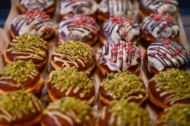 (260212) -- WARSAW, Feb. 12, 2026 (Xinhua) -- Assorted doughnuts are displayed at a pastry shop in Warsaw, Poland on Feb. 12, 2026. People in Poland eat traditional doughnuts on Fat Thursday to mark the last Thursday before the start of Lent. (Photo by Aleksy Witwicki/Xinhua)
