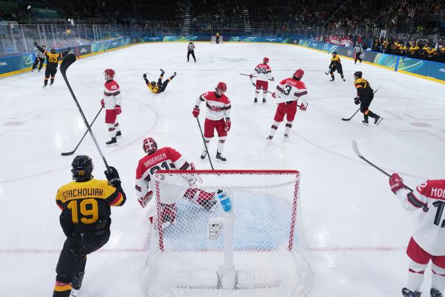 (260213) -- MILAN, Feb. 13, 2026 (Xinhua) -- Players of Germany celebrate a goal during the ice hockey men's preliminary round group C match between Denmark and Germany at the Milan-Cortina 2026 Olympic Winter Games in Milan, Italy, Feb. 12, 2026. (Wang Kaiyan/Pool via Xinhua)