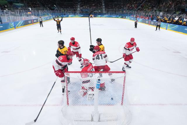 (260213) -- MILAN, Feb. 13, 2026 (Xinhua) -- Players of Germany celebrate a goal during the ice hockey men's preliminary round group C match between Denmark and Germany at the Milan-Cortina 2026 Olympic Winter Games in Milan, Italy, Feb. 12, 2026. (Wang Kaiyan/Pool via Xinhua)