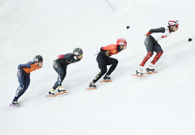 (260213) -- MILAN, Feb. 13, 2026 (Xinhua) -- Sun Long (2nd R) of China competes during the short track speed skating men's 1000m semifinal at the Milan-Cortina 2026 Olympic Winter Games in Milan, Italy, Feb. 12, 2026. (Xinhua/Li Ming)