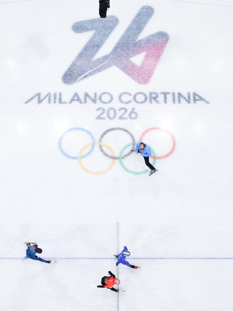 (260213) -- MILAN, Feb. 13, 2026 (Xinhua) -- Sun Long (bottom) of China commpetes during the short track speed skating men's 1000m quarterfinal at the Milan-Cortina 2026 Olympic Winter Games in Milan, Italy, Feb. 12, 2026. (Xinhua/Chen Yichen)