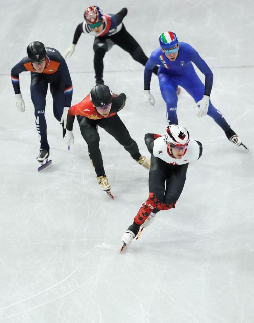 (260213) -- MILAN, Feb. 13, 2026 (Xinhua) -- Liu Shaoang (2nd, L) of China competes during the short track speed skating men's 1000m quarterfinal at the Milan-Cortina 2026 Olympic Winter Games in Milan, Italy, Feb. 12, 2026. (Xinhua/Li Ming)