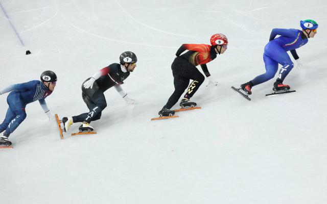 (260213) -- MILAN, Feb. 13, 2026 (Xinhua) -- Sun Long (2nd R) of China competes during the short track speed skating men's 1000m quarterfinal at the Milan-Cortina 2026 Olympic Winter Games in Milan, Italy, Feb. 12, 2026. (Xinhua/Li Ming)