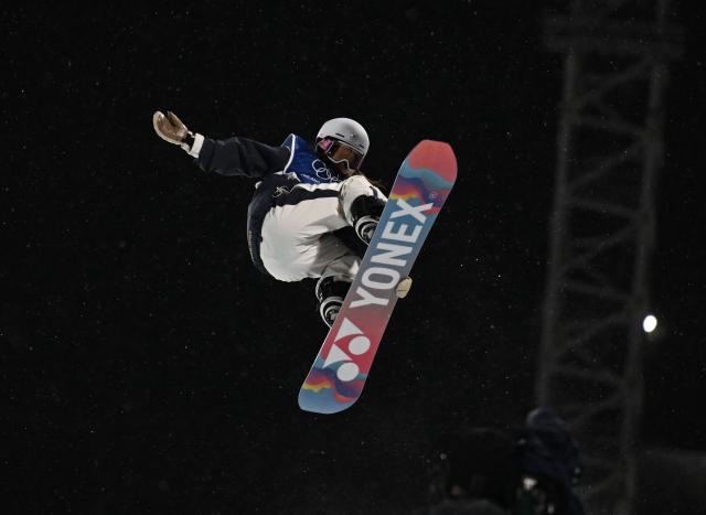(260213) -- LIVIGNO, Feb. 13, 2026 (Xinhua) -- Tomita Sena of Japan competes during the women's snowboard halfpipe final at the Milan-Cortina 2026 Olympic Winter Games in Livigno, Italy, Feb. 12, 2026. (Xinhua/Xia Yifang)