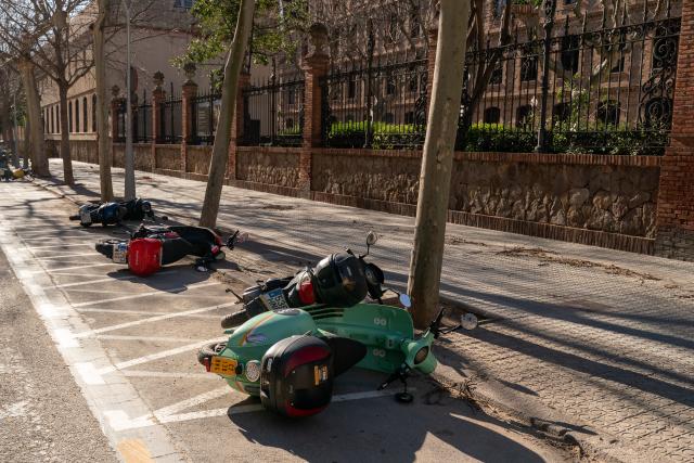 (260213) -- BARCELONA, Feb. 13, 2026 (Xinhua) -- This photo taken on Feb. 12, 2026 shows motorcycles knocked over by strong winds in Barcelona, Spain.
  Winds gusting at over 100 kilometers per hour have caused injuries, structural damage and transport disruptions in the northeastern Spanish region of Catalonia.
  The strong winds, brought by Storm Nils, are the latest in a series of extreme weather events affecting Spain since the beginning of the year. Catalonia was placed on red alert, with schools and colleges closed as a precaution.
  By midday Thursday, nearly 100 flights had been canceled at Barcelona's El Prat Airport, while dozens of incoming flights were diverted to other airports. (Photo by Joan Gosa/Xinhua)