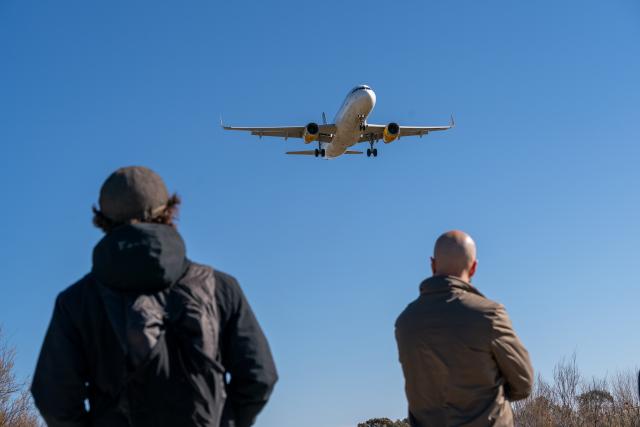 (260213) -- BARCELONA, Feb. 13, 2026 (Xinhua) -- People watch a plane preparing to land at Barcelona's El Prat airport in Barcelona, Spain, on Feb. 12, 2026.
  Winds gusting at over 100 kilometers per hour have caused injuries, structural damage and transport disruptions in the northeastern Spanish region of Catalonia.
  The strong winds, brought by Storm Nils, are the latest in a series of extreme weather events affecting Spain since the beginning of the year. Catalonia was placed on red alert, with schools and colleges closed as a precaution.
  By midday Thursday, nearly 100 flights had been canceled at Barcelona's El Prat Airport, while dozens of incoming flights were diverted to other airports. (Photo by Joan Gosa/Xinhua)