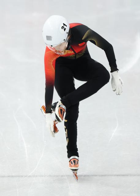 (260213) -- MILAN, Feb. 13, 2026 (Xinhua) -- Zhang Chutong of China reacts after the short track speed skating women's 500m quarterfinal at the Milan-Cortina 2026 Olympic Winter Games in Milan, Italy, Feb. 12, 2026. (Xinhua/Li Ming)