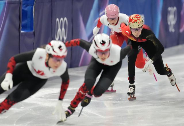(260213) -- MILAN, Feb. 13, 2026 (Xinhua) -- Fan Kexin (1st R) of China competes during the short track speed skating women's 500m quarterfinal at the Milan-Cortina 2026 Olympic Winter Games in Milan, Italy, Feb. 12, 2026. (Xinhua/Xue Yuge)