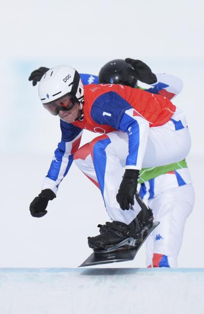 (260213) -- LIVIGNO, Feb. 13, 2026 (Xinhua) -- Aidan Chollet of France competes during the snowboard men's cross semifinal at the Milan-Cortina 2026 Olympic Winter Games in Livigno, Italy, Feb. 12, 2026. (Xinhua/Xia Yifang)