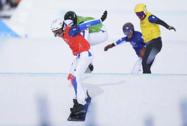 (260213) -- LIVIGNO, Feb. 13, 2026 (Xinhua) -- Aidan Chollet (front) of France competes during the snowboard men's cross semifinal at the Milan-Cortina 2026 Olympic Winter Games in Livigno, Italy, Feb. 12, 2026. (Xinhua/Xia Yifang)