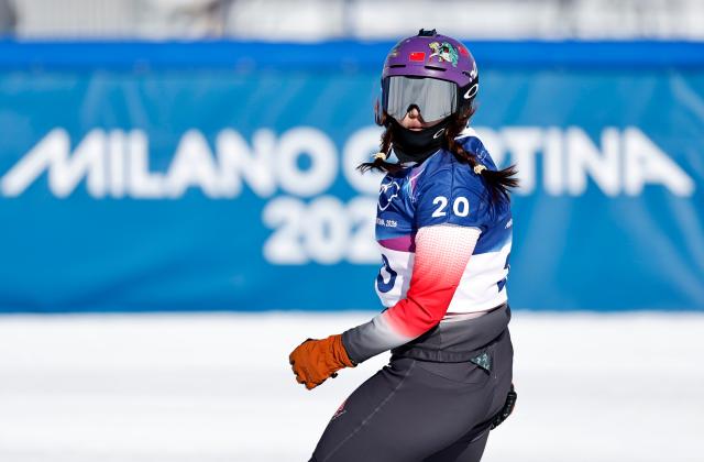 (260213) -- LIVIGNO, Feb. 13, 2026 (Xinhua) -- Yongqinglamu of China competes during the snowboard women's cross seeding at the Milan-Cortina 2026 Olympic Winter Games in Livigno, Italy, Feb. 13, 2026. (Xinhua/Wang Peng)