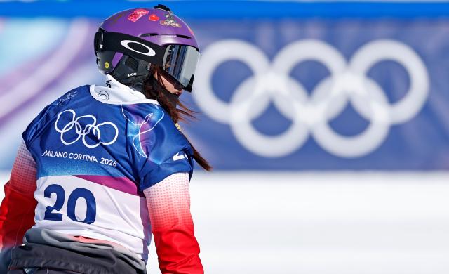 (260213) -- LIVIGNO, Feb. 13, 2026 (Xinhua) -- Yongqinglamu of China competes during the snowboard women's cross seeding at the Milan-Cortina 2026 Olympic Winter Games in Livigno, Italy, Feb. 13, 2026. (Xinhua/Wang Peng)