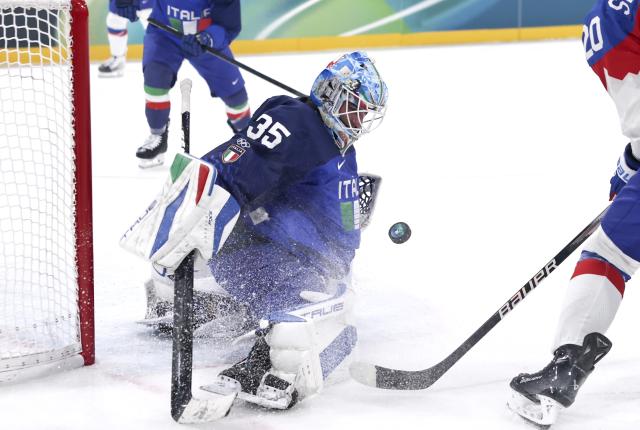 (260213) -- MILAN, Feb. 13, 2026 (Xinhua) -- Davide Fadani, goalkeeper of Italy, makes a save during the ice hockey men's preliminary round group B match between Italy and Slovakia at the Milan-Cortina 2026 Olympic Winter Games in Milan, Italy, Feb. 13, 2026. (Xinhua/Wang Kaiyan)
