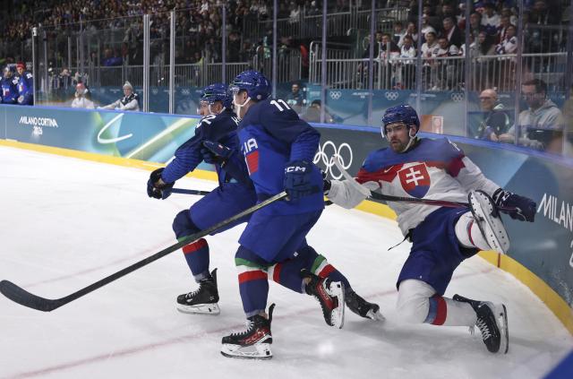 (260213) -- MILAN, Feb. 13, 2026 (Xinhua) -- Peter Ceresnak (R) of Slovakia competes during the ice hockey men's preliminary round group B match between Italy and Slovakia at the Milan-Cortina 2026 Olympic Winter Games in Milan, Italy, Feb. 13, 2026. (Xinhua/Wang Kaiyan)