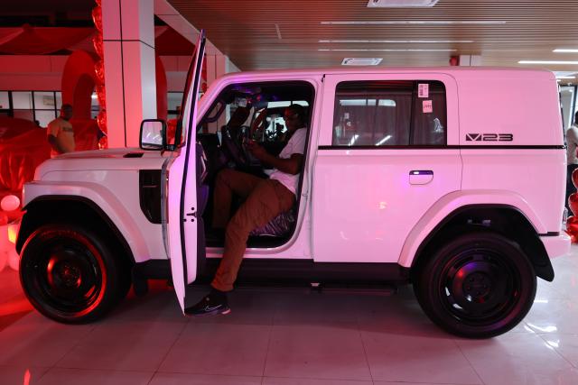 (260213) -- ACCRA, Feb. 13, 2026 (Xinhua) -- A visitor tries a vehicle during a launching event in Accra, Ghana, on Feb. 11, 2026. TO GO WITH: "Chinese auto firm launches range of automobiles in Ghana" (Photo by Seth/Xinhua)
