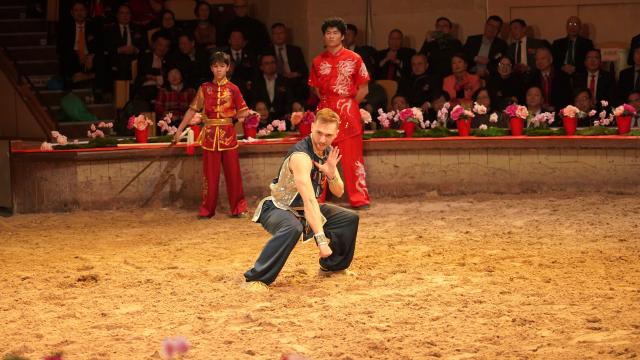 (260213) -- PARIS, Feb. 13, 2026 (Xinhua) -- An artist performs martial arts during a gala celebrating the Chinese Year of the Horse at the Great Stables in the estate of the Chateau de Chantilly in the Hauts-de-France region, France, Feb. 11, 2026. Co-hosted by the Hauts-de-France regional authorities and the Chinese Embassy in France, the event was distinct from many other Chinese New Year activities. At the Great Stables, the highlight was a distinctly local art form: traditional French equestrian performance.
   TO GO WITH "Feature: French equestrian gala marks Chinese Year of the Horse" (Xinhua/Cui Kexin)
