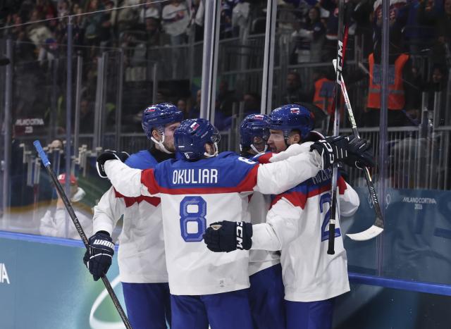 (260213) -- MILAN, Feb. 13, 2026 (Xinhua) -- Players of Slovakia celebrate during the ice hockey men's preliminary round group B match between Italy and Slovakia at the Milan-Cortina 2026 Olympic Winter Games in Milan, Italy, Feb. 13, 2026. (Xinhua/Wang Kaiyan)