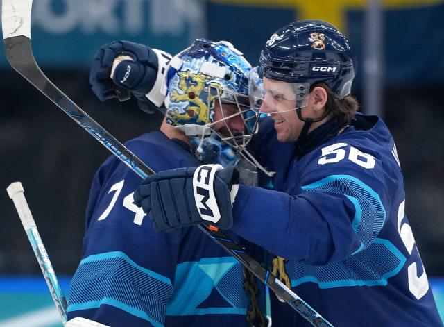 (260213) -- MILAN, Feb. 13, 2026 (Xinhua) -- Erik Haula (R) of Finland celebrates with teammate Juuse Saros during the ice hockey men's preliminary round group B match between Finland and Sweden at the Milan-Cortina 2026 Olympic Winter Games in Milan, Italy, Feb. 13, 2026. (Xinhua/Tao Xiyi)