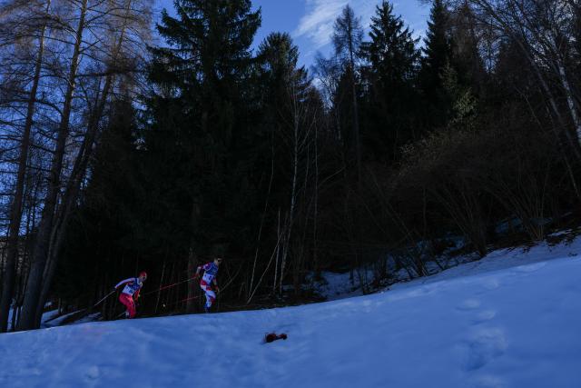 (260213) -- TESERO, Feb. 13, 2026 (Xinhua) -- Milos Milosavljevic (R) of Serbia and Maciej Starega of Poland compete during the Cross-Country Skiing Men's 10km Interval Start Free at the Milano Cortina 2026 Olympic Winter Games in Tesero, Italy, Feb. 13, 2026. (Xinhua/Peng Ziyang)