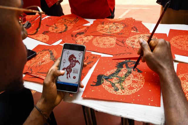 (260213) -- SOA, Feb. 13, 2026 (Xinhua) -- A student paints a horse at the Confucius Institute of the University of Yaounde II in Soa, Cameroon, Feb. 13, 2026. (Xinhua/Kepseu)