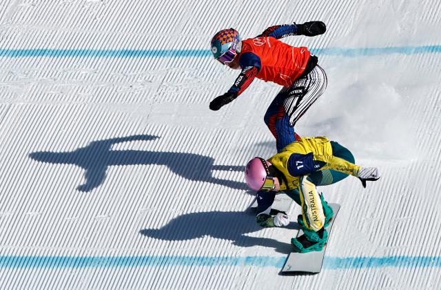 (260213) -- LIVIGNO, Feb. 13, 2026 (Xinhua) -- Josie Baff (bottom) of Australia and Eva Adamczykova of the Czech Republic compete during the women's snowboard cross big final at the Milan-Cortina 2026 Olympic Winter Games in Livigno, Italy, Feb. 13, 2026. (Xinhua/Wang Peng)