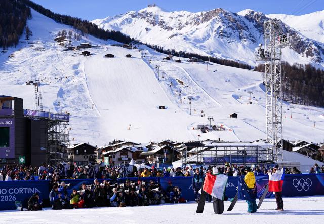 (260213) -- LIVIGNO, Feb. 13, 2026 (Xinhua) -- Gold medalist Josie Baff of Australia, silver medalist Eva Adamczykova of the Czech Republic and bronze medalist Michela Moioli of Italy attend the awarding ceremony of the women's snowboard cross event at the Milan-Cortina 2026 Olympic Winter Games in Livigno, Italy, Feb. 13, 2026. (Xinhua/Wu Huiwo)