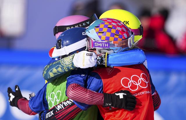 (260213) -- LIVIGNO, Feb. 13, 2026 (Xinhua) -- Josie Baff of Australia, Eva Adamczykova of Czech Republic, Michela Moioli of Italy and Noemie Wiedmer of Switzerland hug each other after the women's snowboard cross big final at the Milan-Cortina 2026 Olympic Winter Games in Livigno, Italy, Feb. 13, 2026. (Xinhua/Wu Huiwo)
