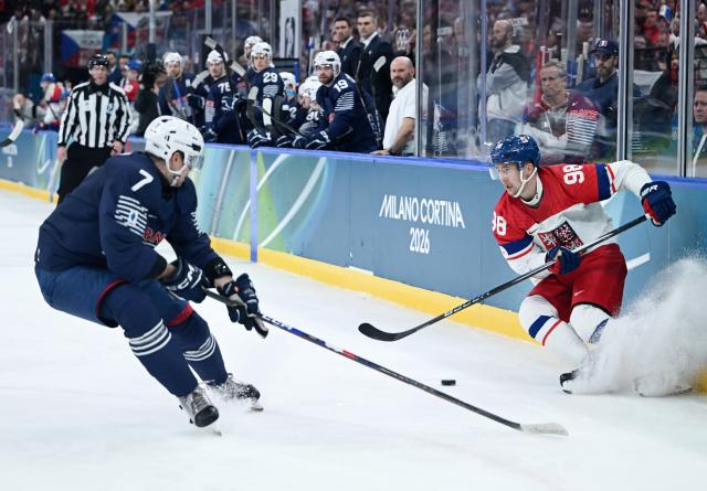 (260213) -- MILAN, Feb. 13, 2026 (Xinhua) -- Martin Necas (R) of the Czech Republic breaks through during the ice hockey men's preliminary round group A match between France and the Czech Republic at the Milan-Cortina 2026 Olympic Winter Games in Milan, Italy, Feb. 13, 2026. (Xinhua/Zhang Haofu)