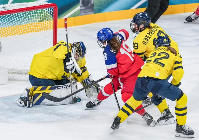(260213) -- MILAN, Feb. 13, 2026 (Xinhua) -- Ebba Svensson Traff (1st L) of Sweden saves a goal during the ice hockey women's play-offs quarterfinals match between the Czech Republic and Sweden at the Milan-Cortina 2026 Olympic Winter Games in Milan, Italy, Feb. 13, 2026. (Xinhua/Sun Fei)