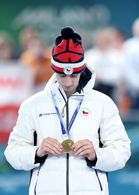 (260213) -- MILAN, Feb. 13, 2026 (Xinhua) -- Gold medalist Metodej Jilek of the Czech Republic looks at his medal during the awarding ceremony of the speed skating men's 10000m event at the Milan-Cortina 2026 Olympic Winter Games in Milan, Italy, Feb. 13, 2026. (Xinhua/Li Jing)