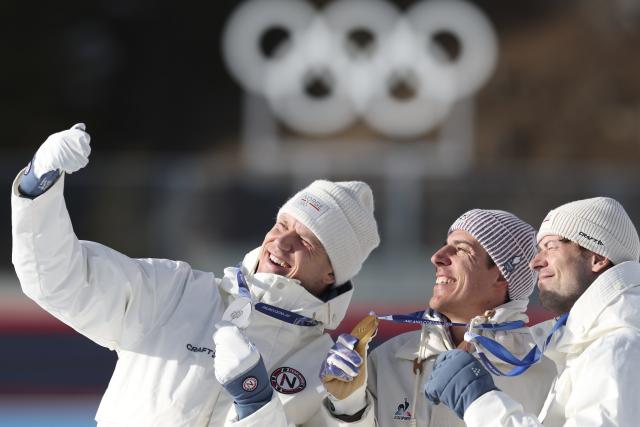 (260213) -- ANTERSELVA, Feb. 13, 2026 (Xinhua) -- Gold medalist Quentin Fillon Maillet (C) of France, silver medalist Vetle Sjaastad Christiansen (L) of Norway, and bronze medalist Sturla Holm Laegreid of Norway take a selfie during the awarding ceremony of the biathlon men's 10km sprint event at the Milan-Cortina 2026 Olympic Winter Games in Anterselva, Italy, Feb. 13, 2026. (Xinhua/Zhang Tao)