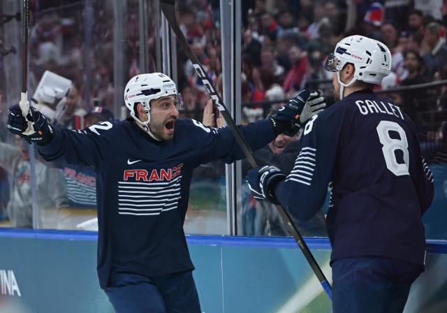 (260213) -- MILAN, Feb. 13, 2026 (Xinhua) -- Hugo Gallet (R) of France celebrates with his teammate during the ice hockey men's preliminary round group A match between France and the Czech Republic at the Milan-Cortina 2026 Olympic Winter Games in Milan, Italy, Feb. 13, 2026. (Xinhua/Zhang Haofu)
