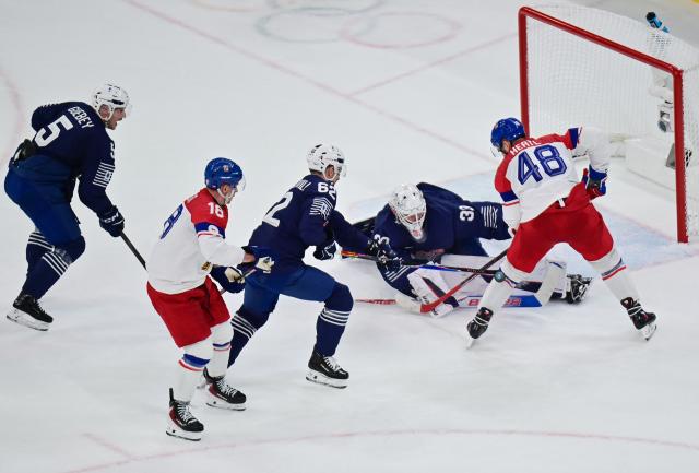 (260213) -- MILAN, Feb. 13, 2026 (Xinhua) -- Tomas Hertl (1st R) of the Czech Republic shoots during the ice hockey men's preliminary round group A match between France and the Czech Republic at the Milan-Cortina 2026 Olympic Winter Games in Milan, Italy, Feb. 13, 2026. (Xinhua/Tao Xiyi)