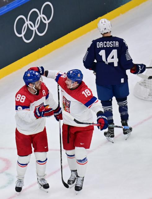 (260213) -- MILAN, Feb. 13, 2026 (Xinhua) -- David Pastrnak (L) of the Czech Republic celebrates scoring during the ice hockey men's preliminary round group A match between France and the Czech Republic at the Milan-Cortina 2026 Olympic Winter Games in Milan, Italy, Feb. 13, 2026. (Xinhua/Tao Xiyi)