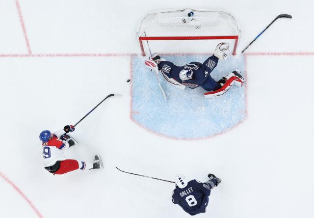 (260213) -- MILAN, Feb. 13, 2026 (Xinhua) -- Jakub Flek of the Czech Republic shoots during the ice hockey men's preliminary round group A match between France and the Czech Republic at the Milan-Cortina 2026 Olympic Winter Games in Milan, Italy, Feb. 13, 2026. (Xinhua/Zhang Haofu)