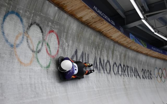 (260213) -- CORTINA D'AMPEZZO, Feb. 13, 2026 (Xinhua) -- Liang Yuxin of China competes during the skeleton women competition heat 1 at the Milan-Cortina 2026 Olympic Winter Games in Cortina, Italy, Feb. 13, 2026. (Xinhua/Lian Yi)